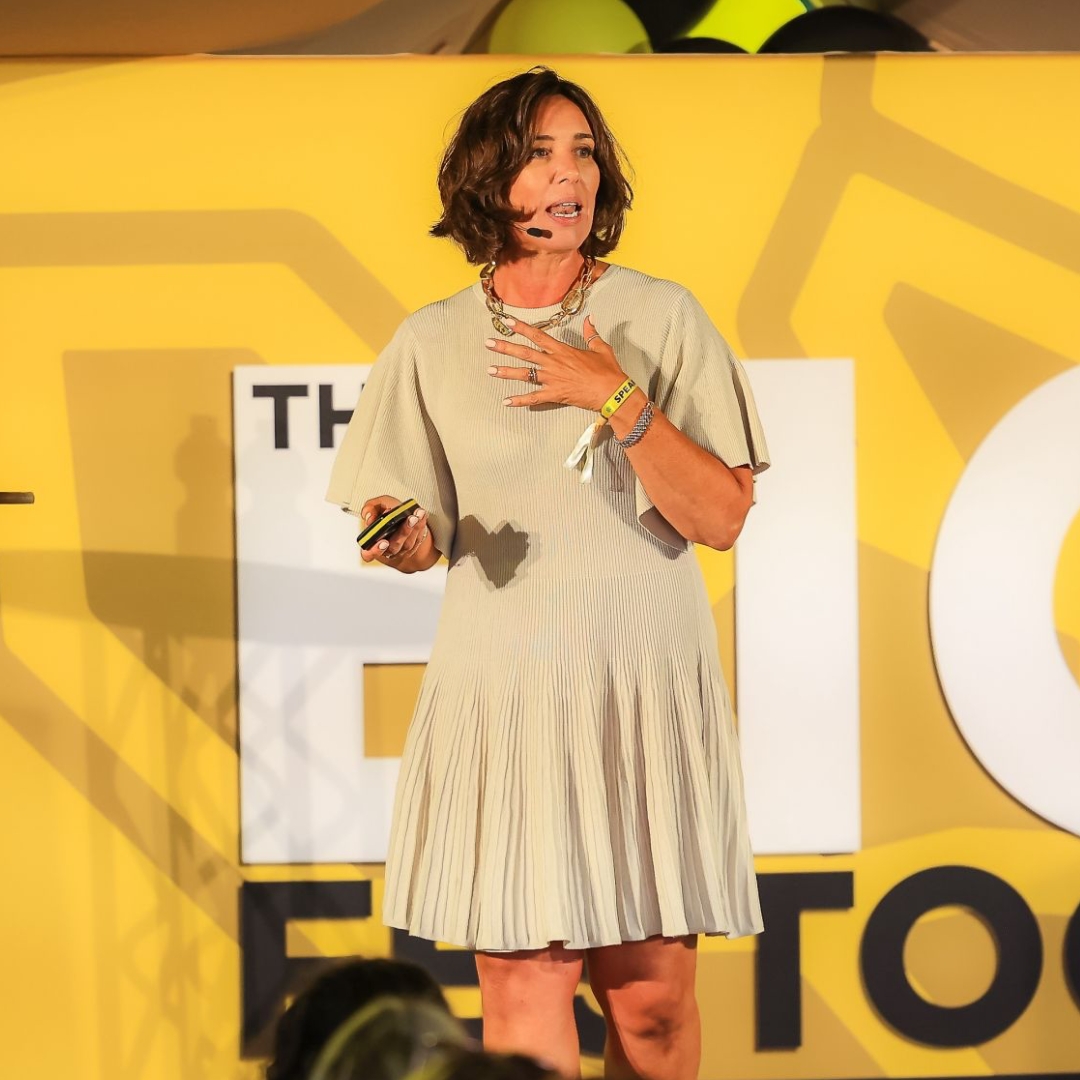 Kim speaking on stage